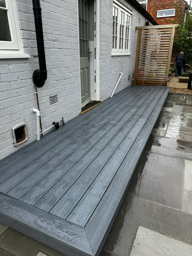 Grey composite decking installation in Lincoln by garden landscapers in Lincoln. Featuring clean lines and modern garden design