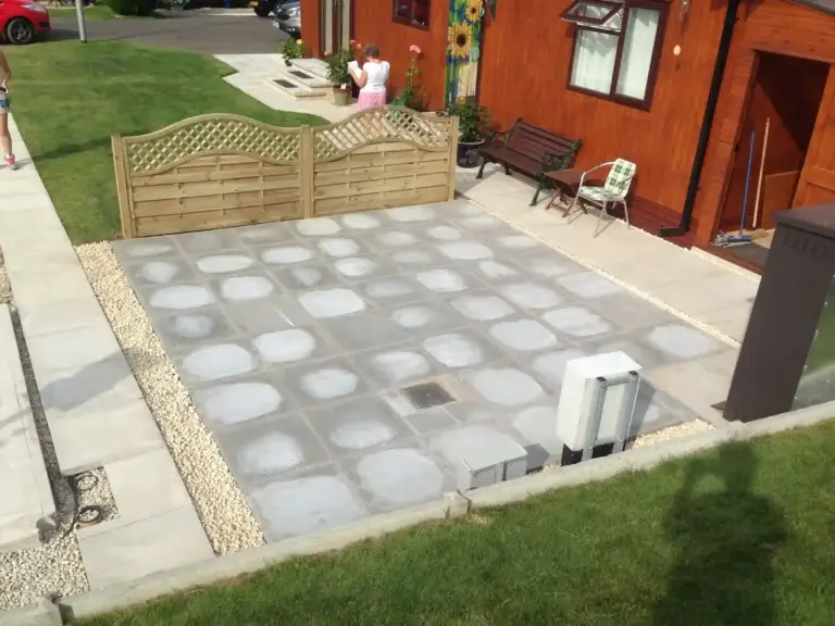 Modern grey block paving patio installation in Lincoln with decorative edging and timber trellis fencing installed at The Elms, Torksey, Lincolnshire, contemporary garden design by landscape gardeners in Lincoln