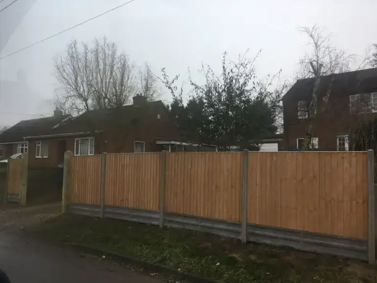 Wooden fence panels Lincoln with concrete posts and double gravel boards installed along a residential front garden in The Elms, Torksey, Lincolnshire, professional fencing installation by garden landscapers in Lincoln