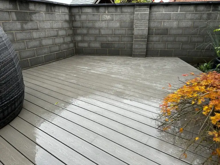 Light grey composite decking installation in garden landscapers in Lincoln., featuring precise flush edges and a smooth weather-resistant finish
