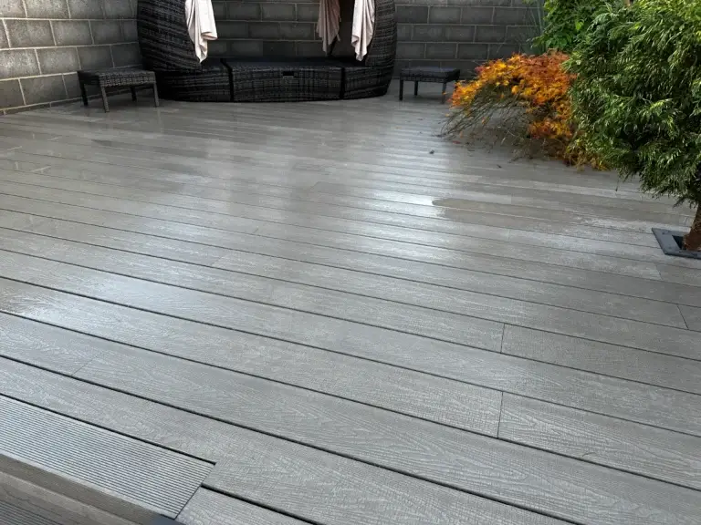 Modern grey composite decking installation in Gainsborough by garden landscapers in Gainsborough.Featuring a sleek low-maintenance garden terrace