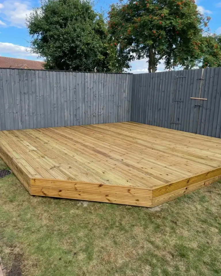 Timber decking installation in Lincoln by garden landscapers in Lincoln. Featuring treated softwood boards with clean angular design