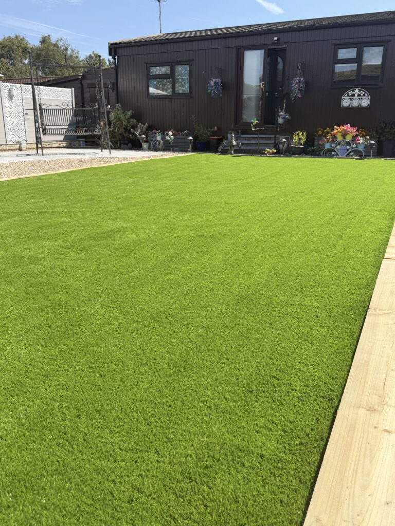 Lawn and paved path in a low maintenance garden near Lincoln