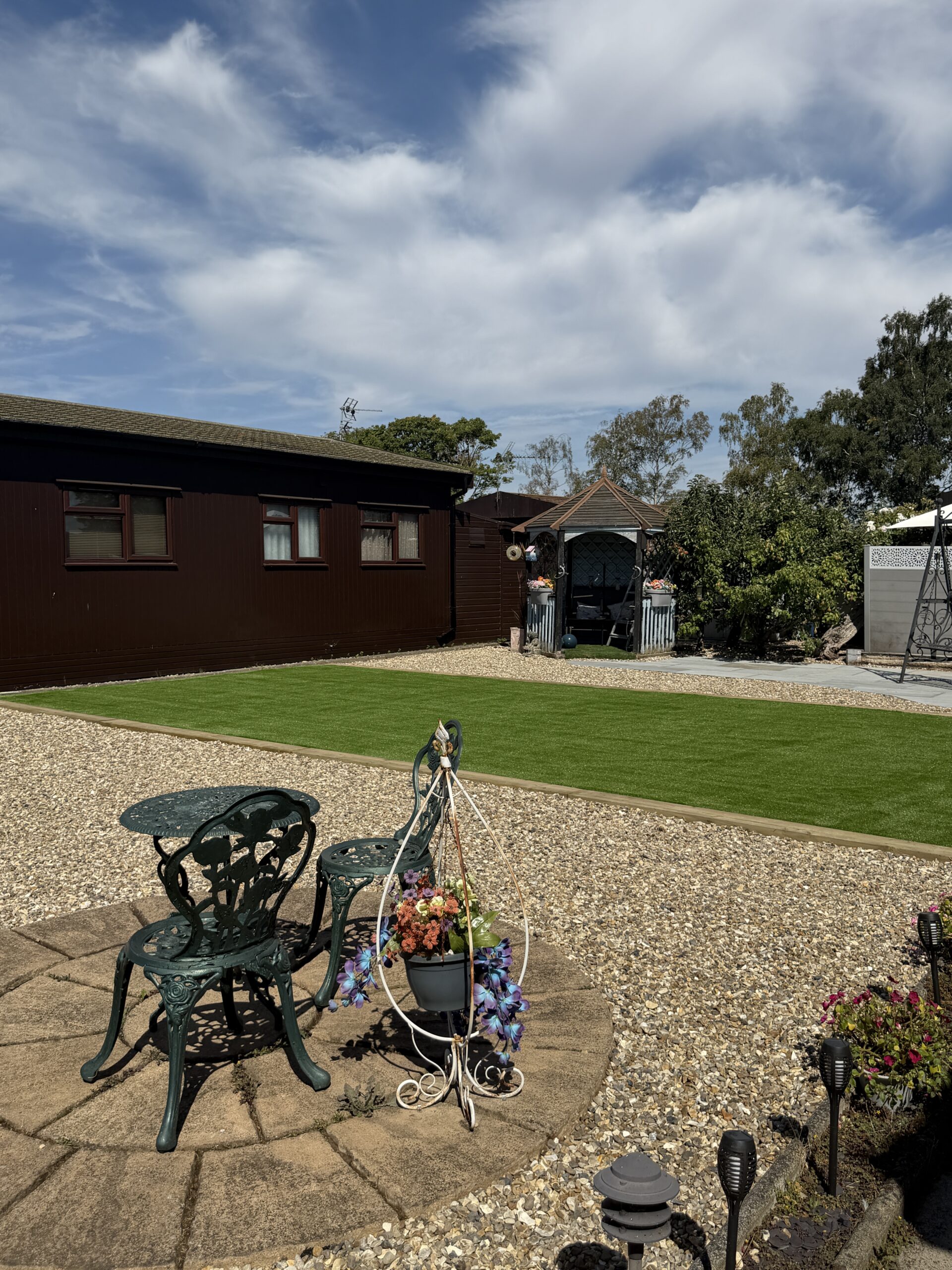 Open lawn with a gravel edge on a garden design Lincoln project