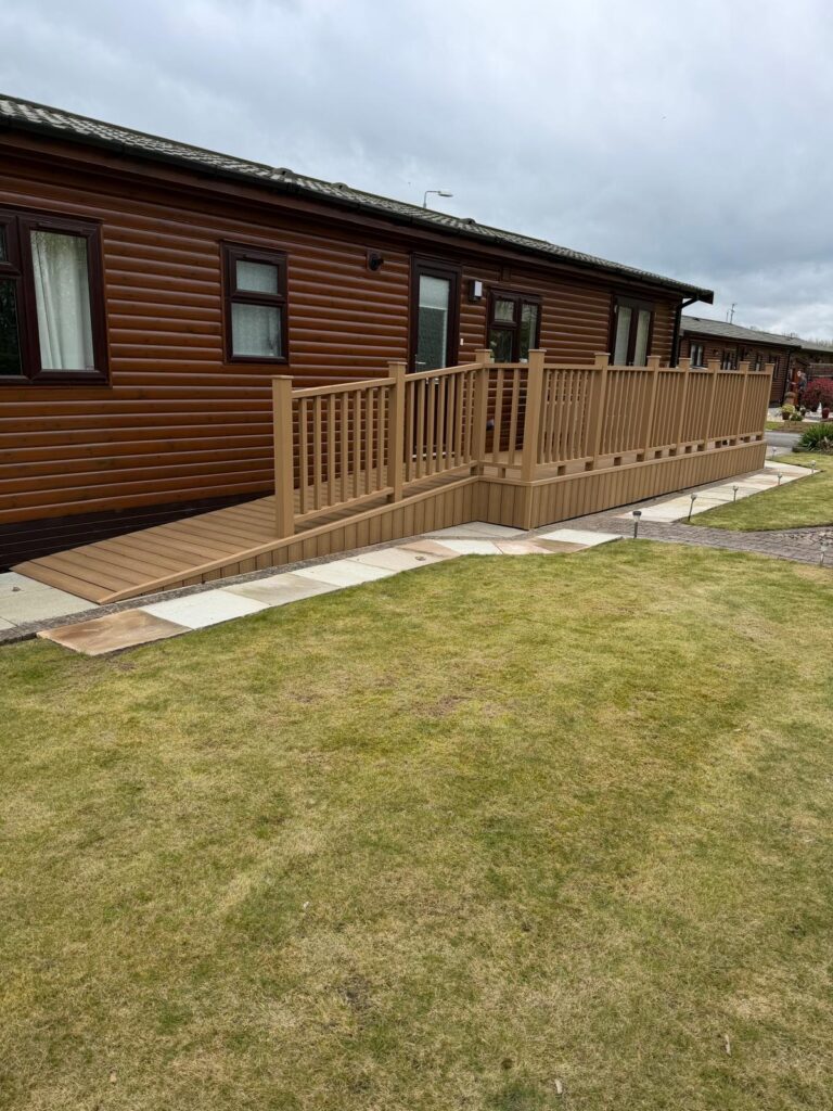 Composite decking installation with balustrades, skirting and access ramp by landscapers in Lincoln