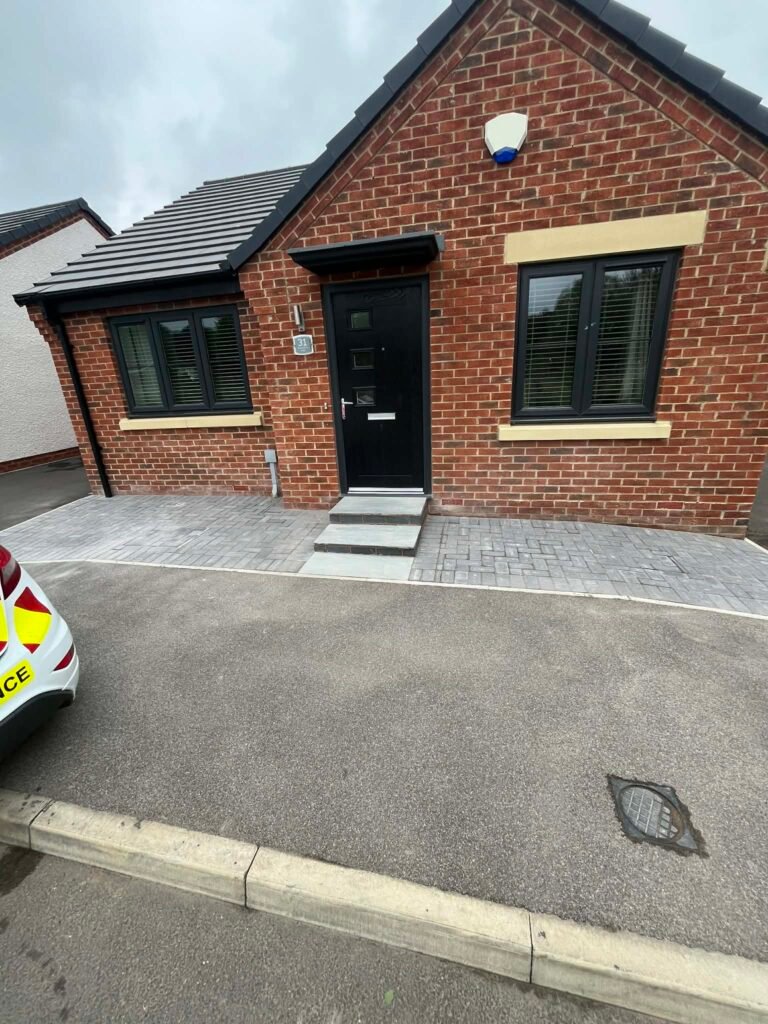 Block paved driveway and brick entrance step on a bungalow