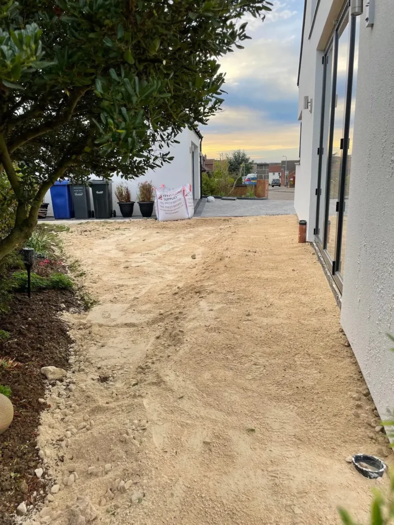 Hardcore compacted as the base at the start of a patio installation in Lincoln