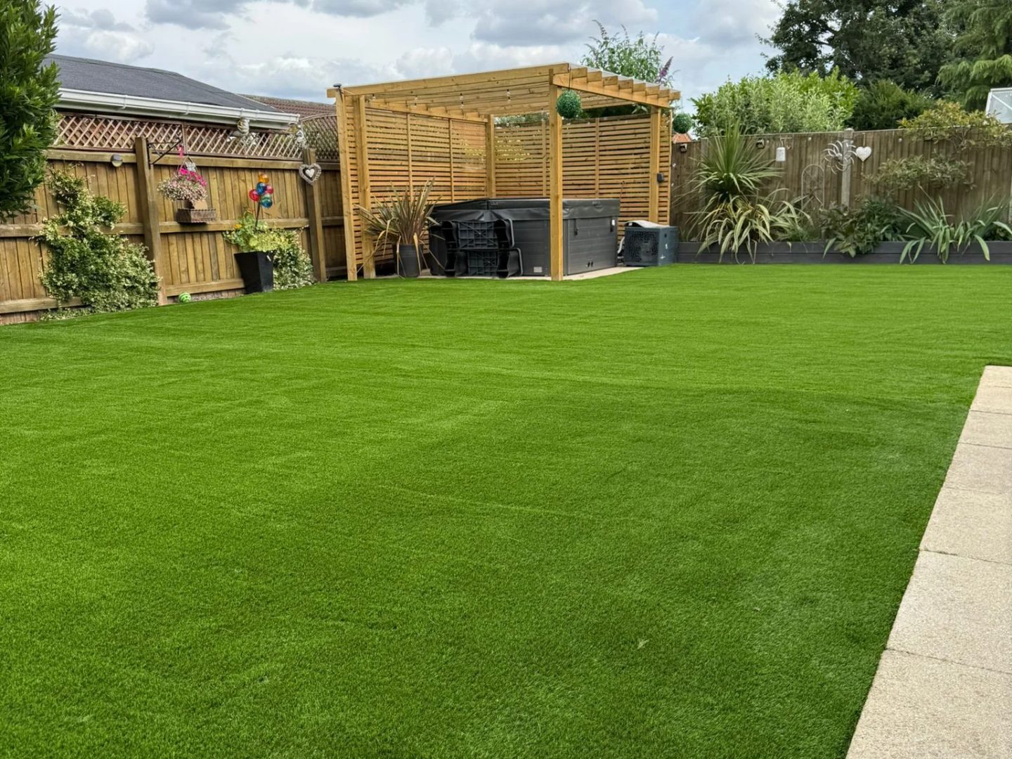 Low maintenance garden Lincoln project with artificial grass and a timber pergola